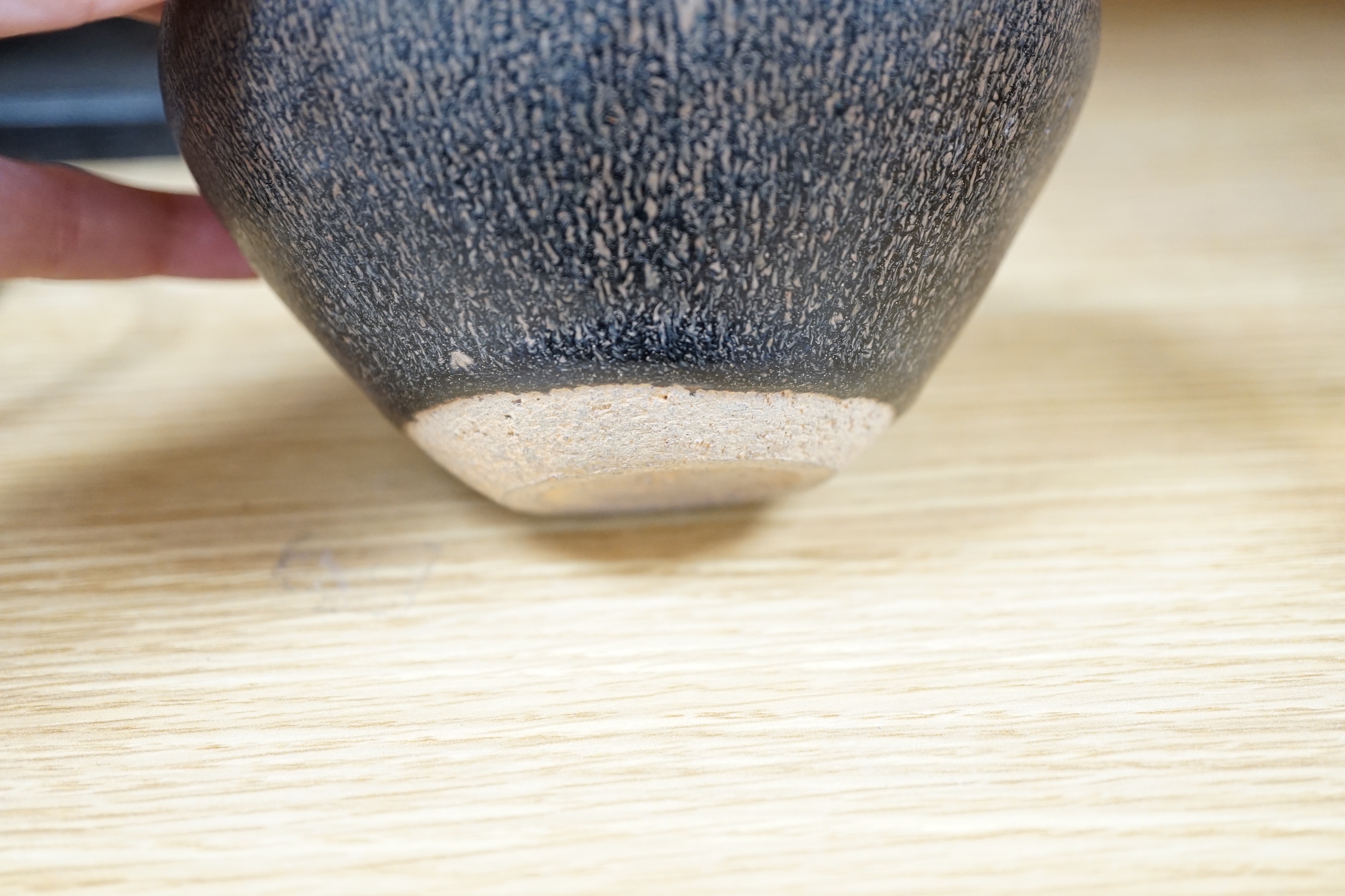 A Chinese brown pottery bowl, 11.5cms diameter